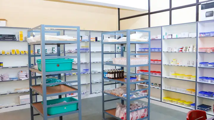The hospital pharmacy, with shelves of medicines