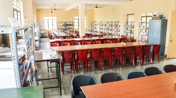 The college library, with bookshelves and long reading tables